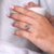Cushion Old European Cut diamond engagement ring with round diamond pave band.