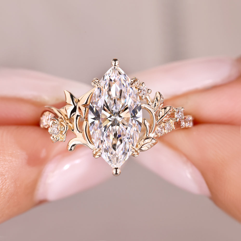Elegant marquise diamond ring with nature detail.
