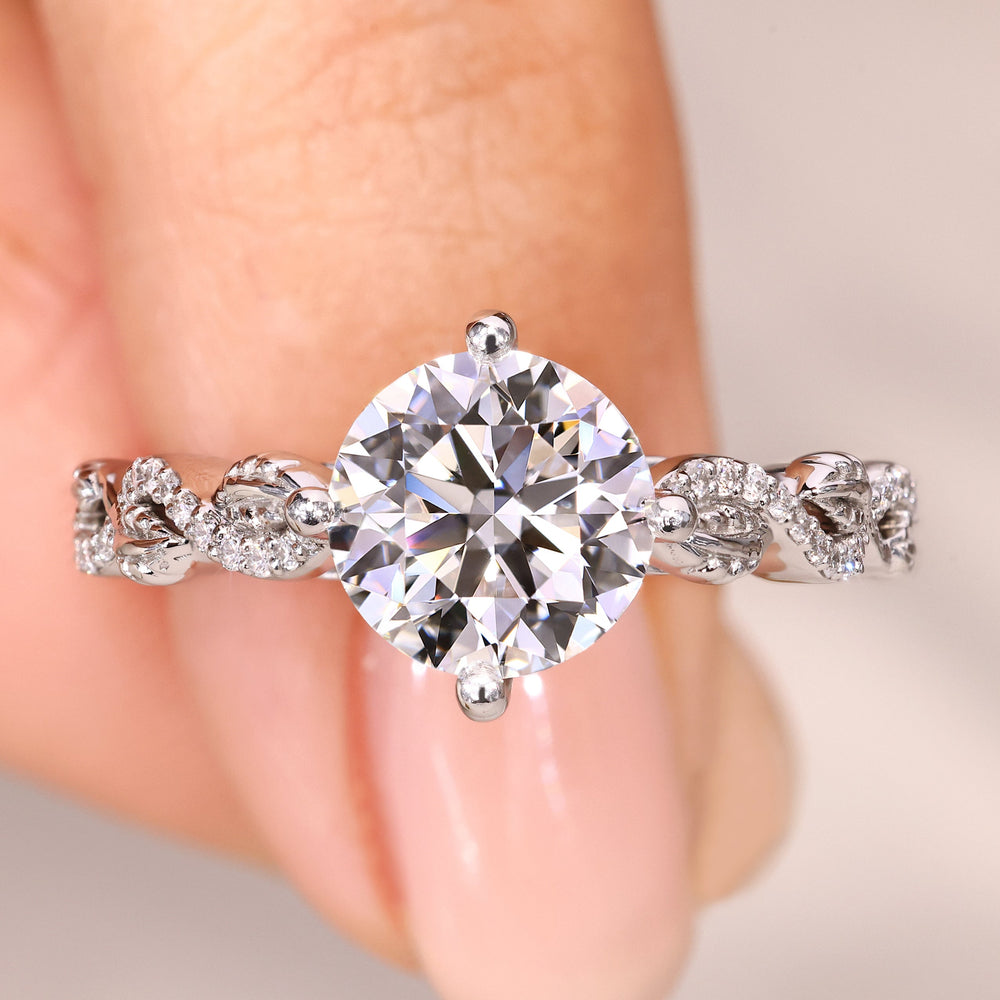 Round cut diamond ring twisted pave style.
