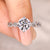 Round cut diamond ring twisted pave style.
