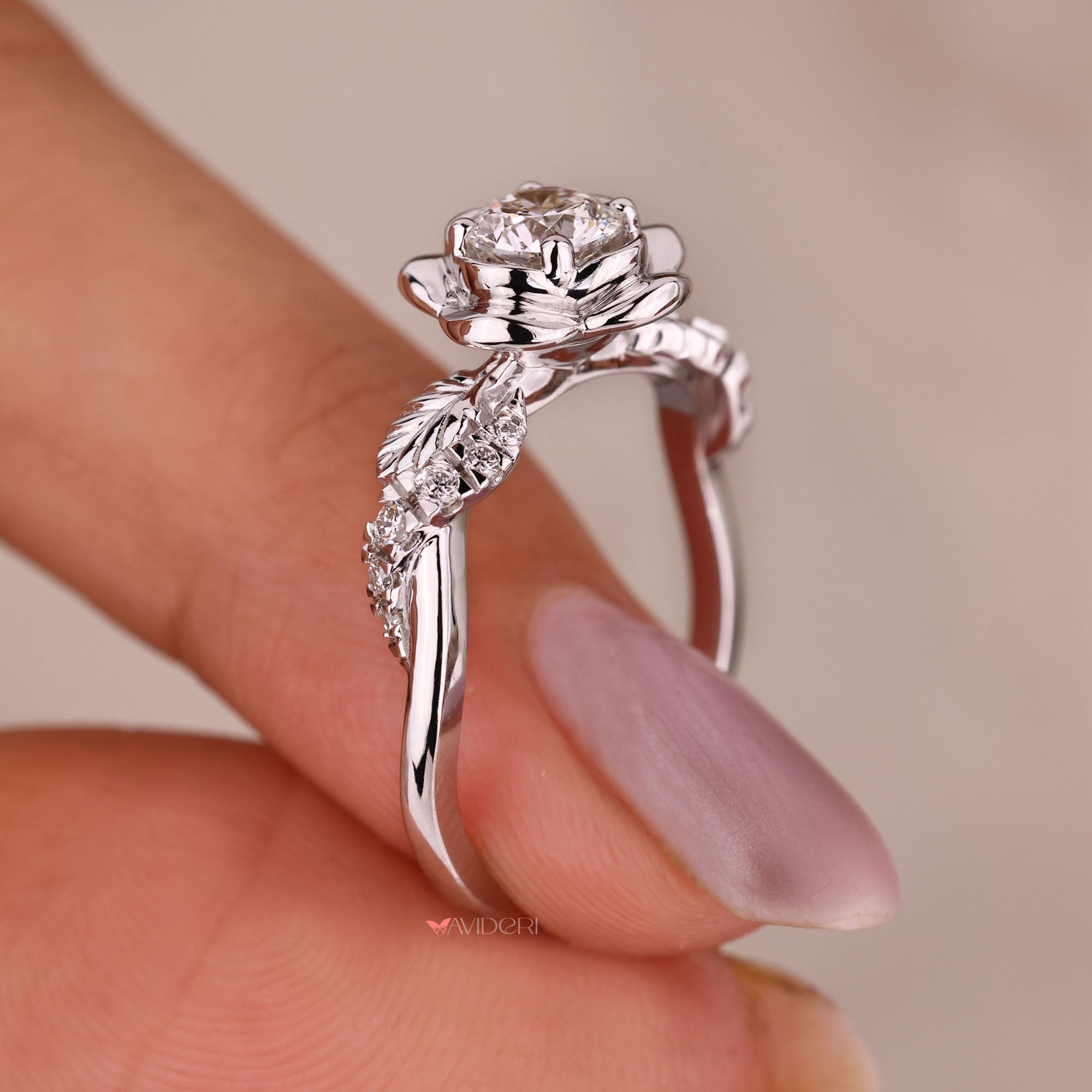 Custom round diamond engagement ring with twisted pave band.