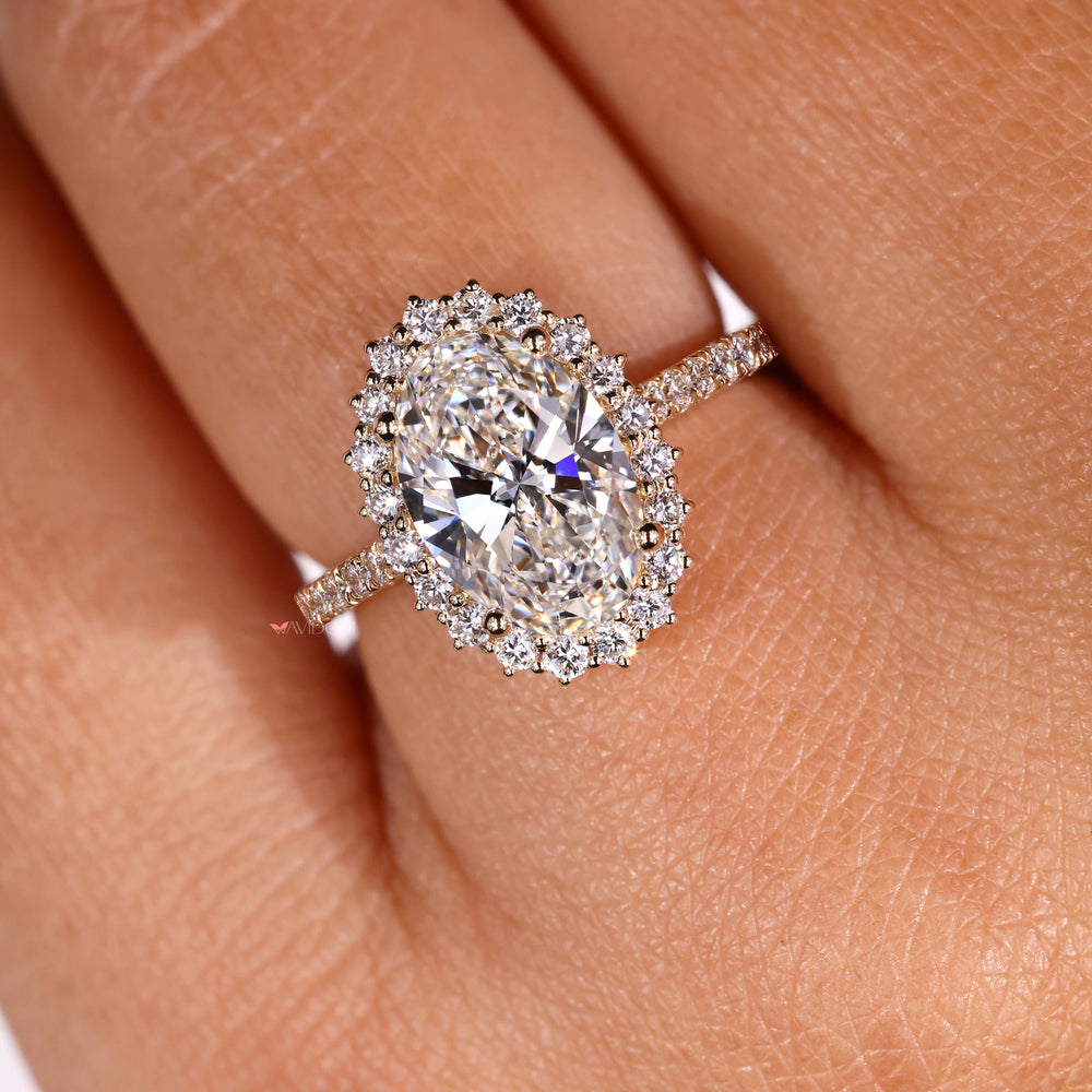 Yellow gold engagement ring with an oval diamond for a luxurious touch.
