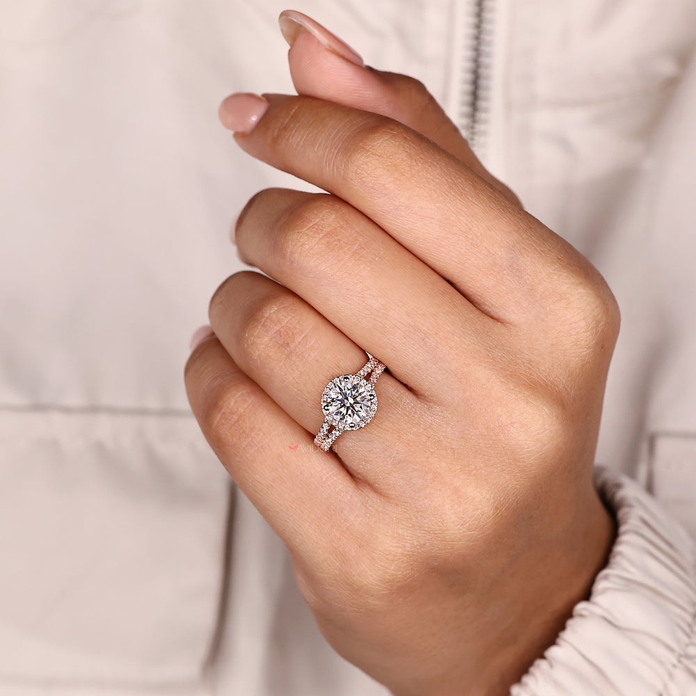 Sparkling round diamond halo ring with pave band.
