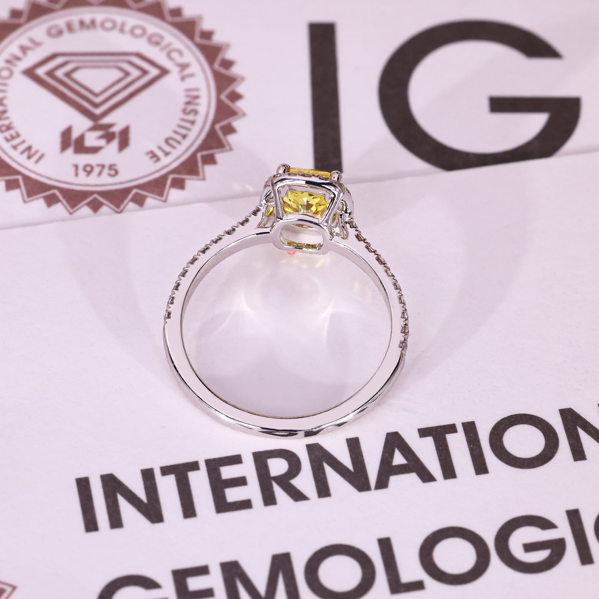 Lab grown yellow diamond cushion cut halo ring.
