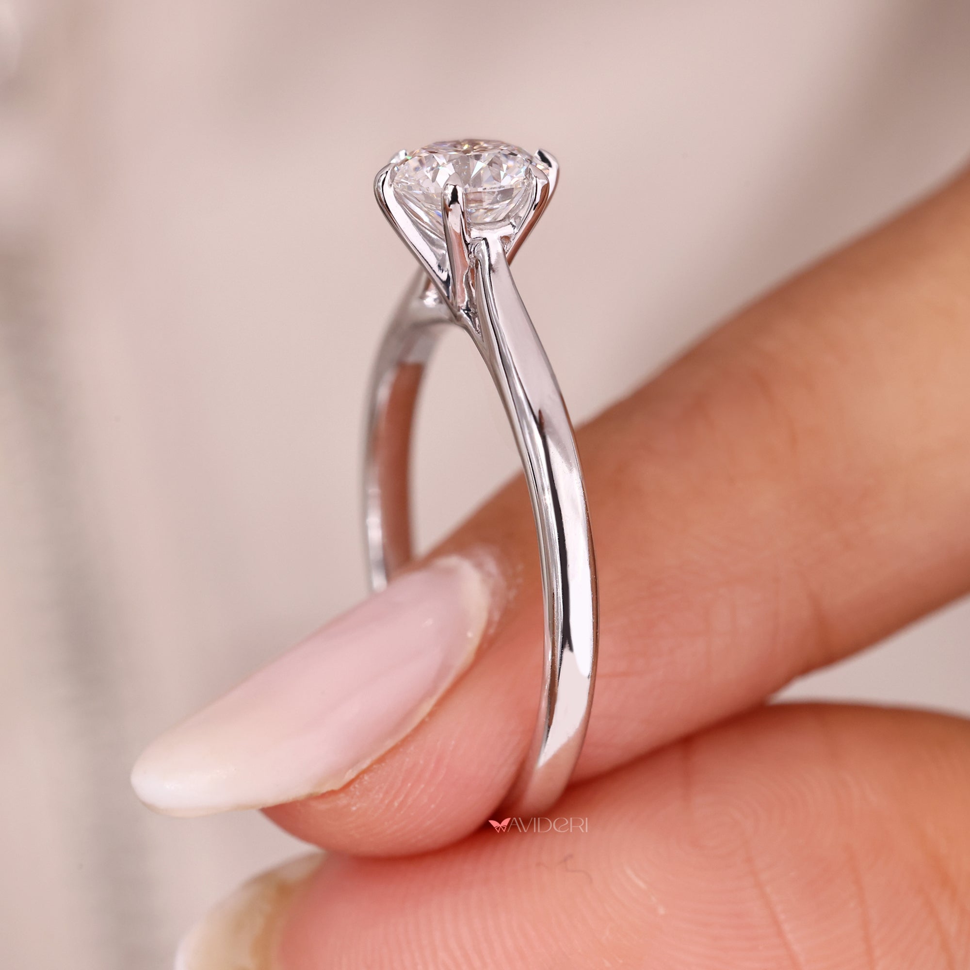 Handmade engagement ring with six claw prong setting.