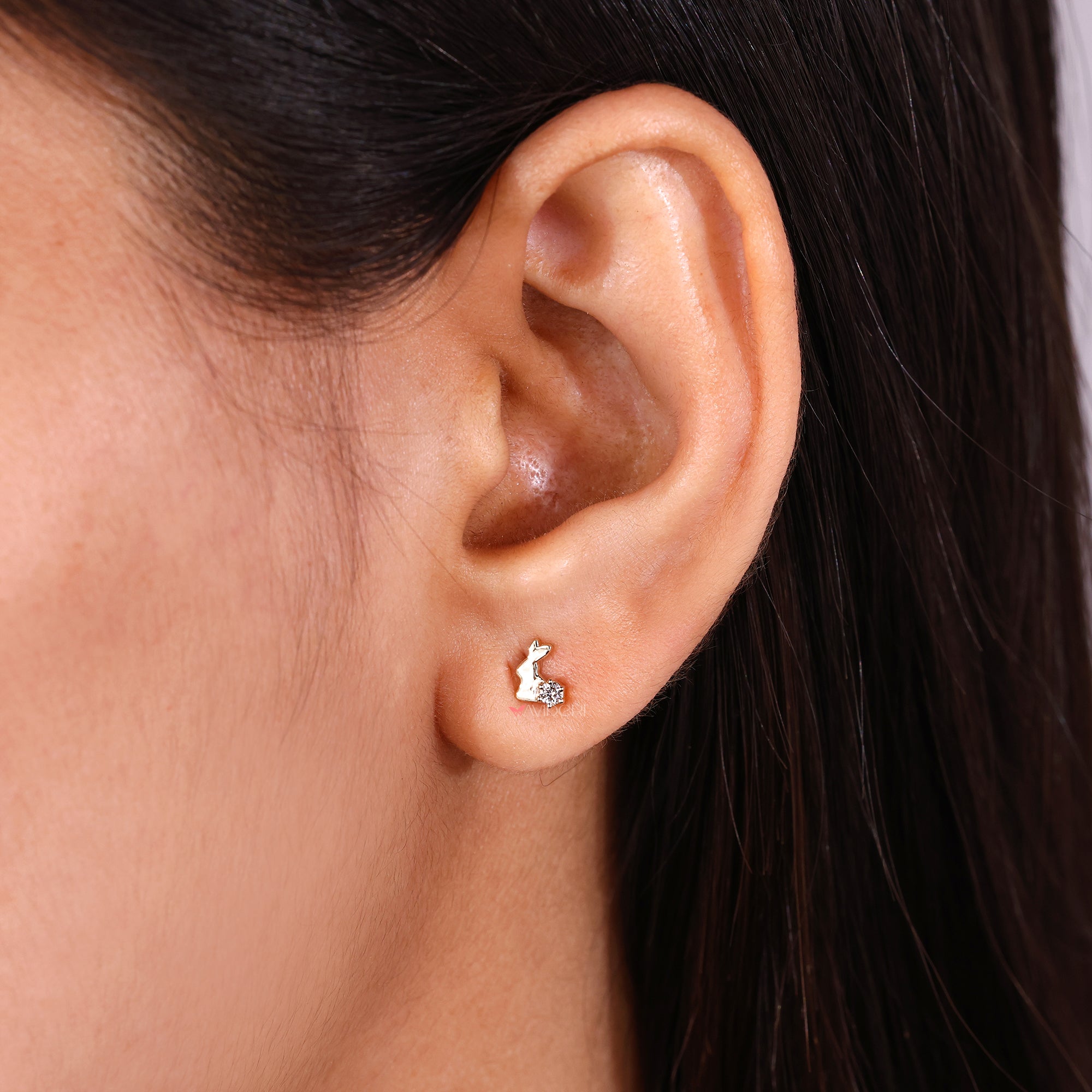 Yellow gold diamond earrings with a rabbit style.
