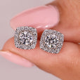 Round diamond stud earrings in white gold.