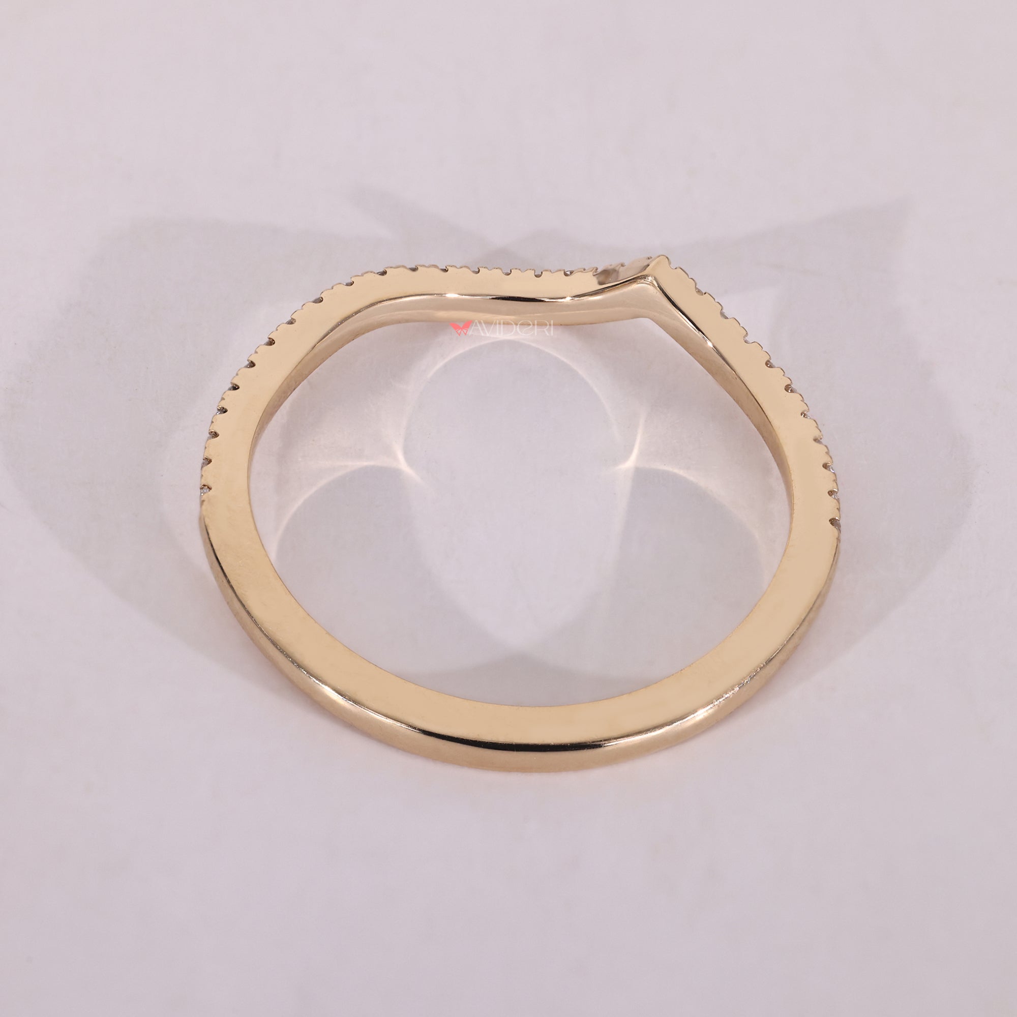Yellow gold wedding band with a row of round diamonds, perfect for a timeless wedding ring.
