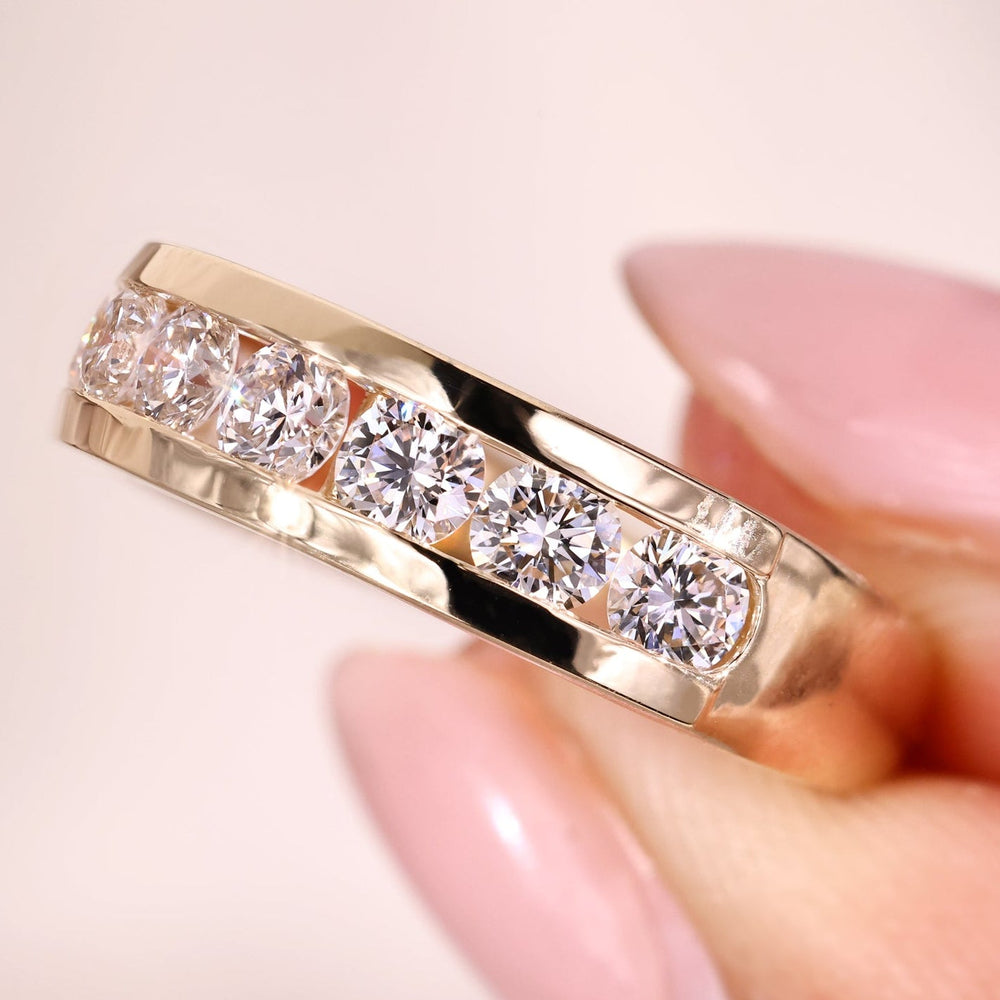 Channel set wedding band with diamonds in yellow gold.