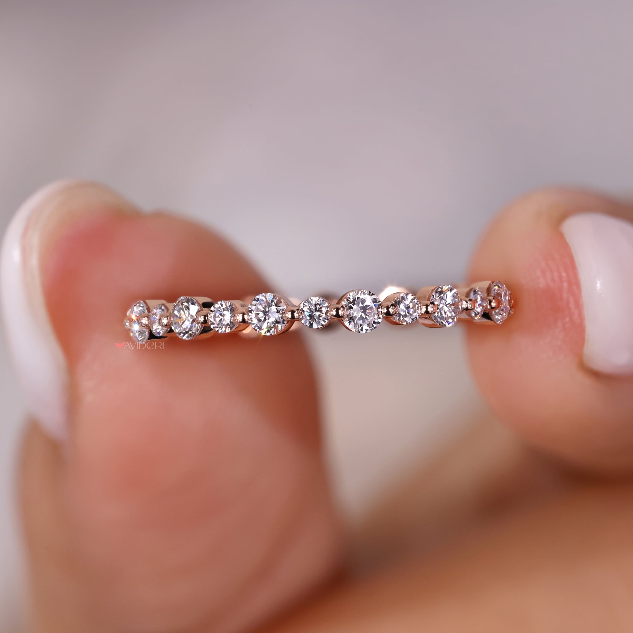 Full eternity band design with round diamond eternity band for added elegance.
