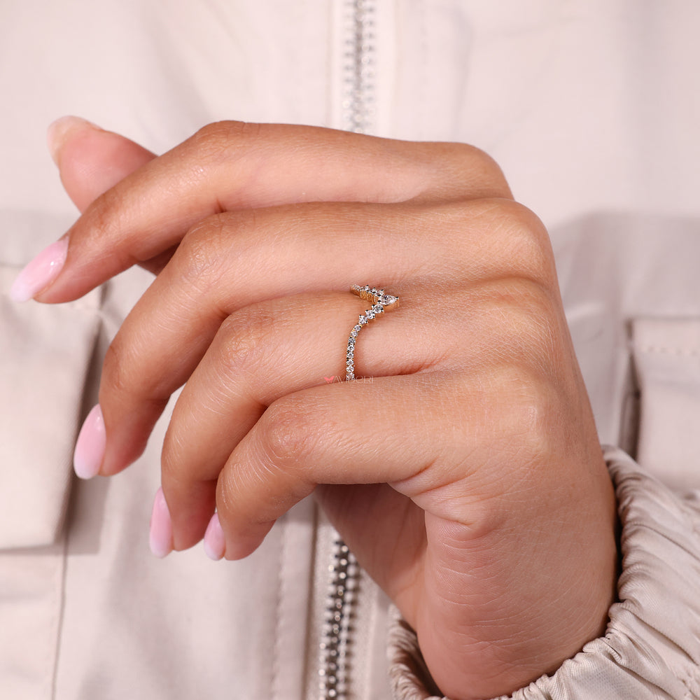 Unique wedding band with pear and round diamonds.