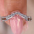 Curved wedding band with round diamonds set in a white gold diamond wedding band.
