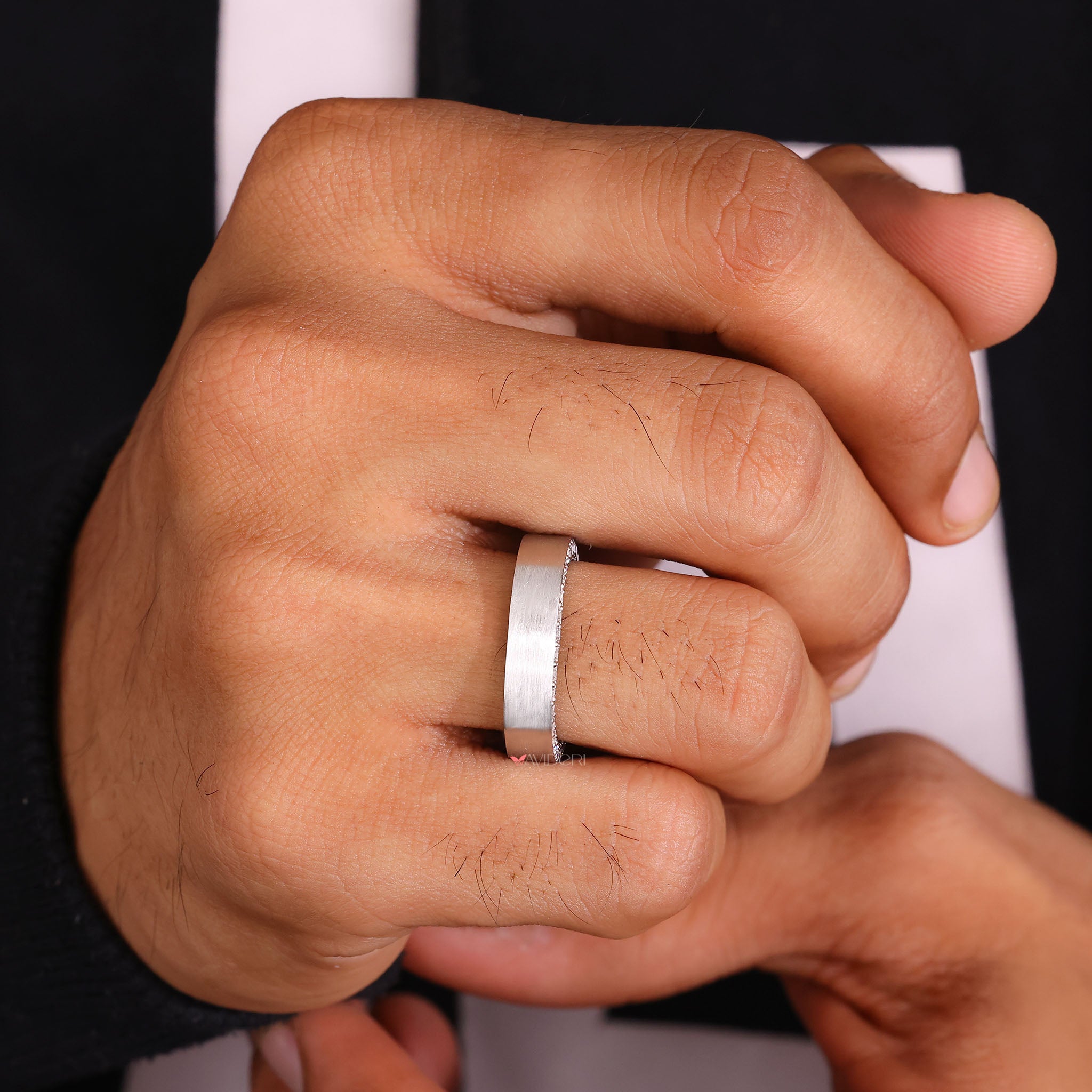 Designer mans wedding band reflects unique design.
