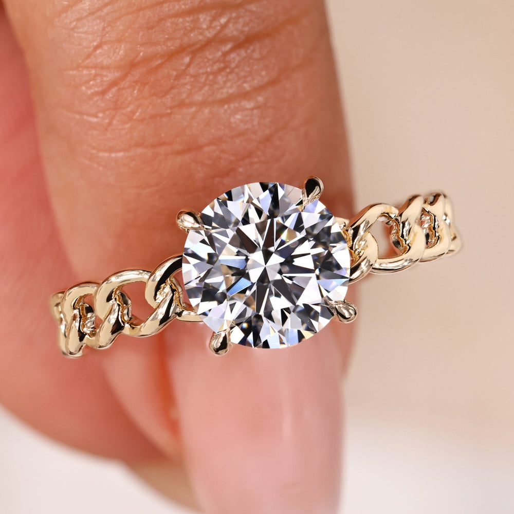 Elegant round solitaire engagement ring with timeless design and sparkle.
