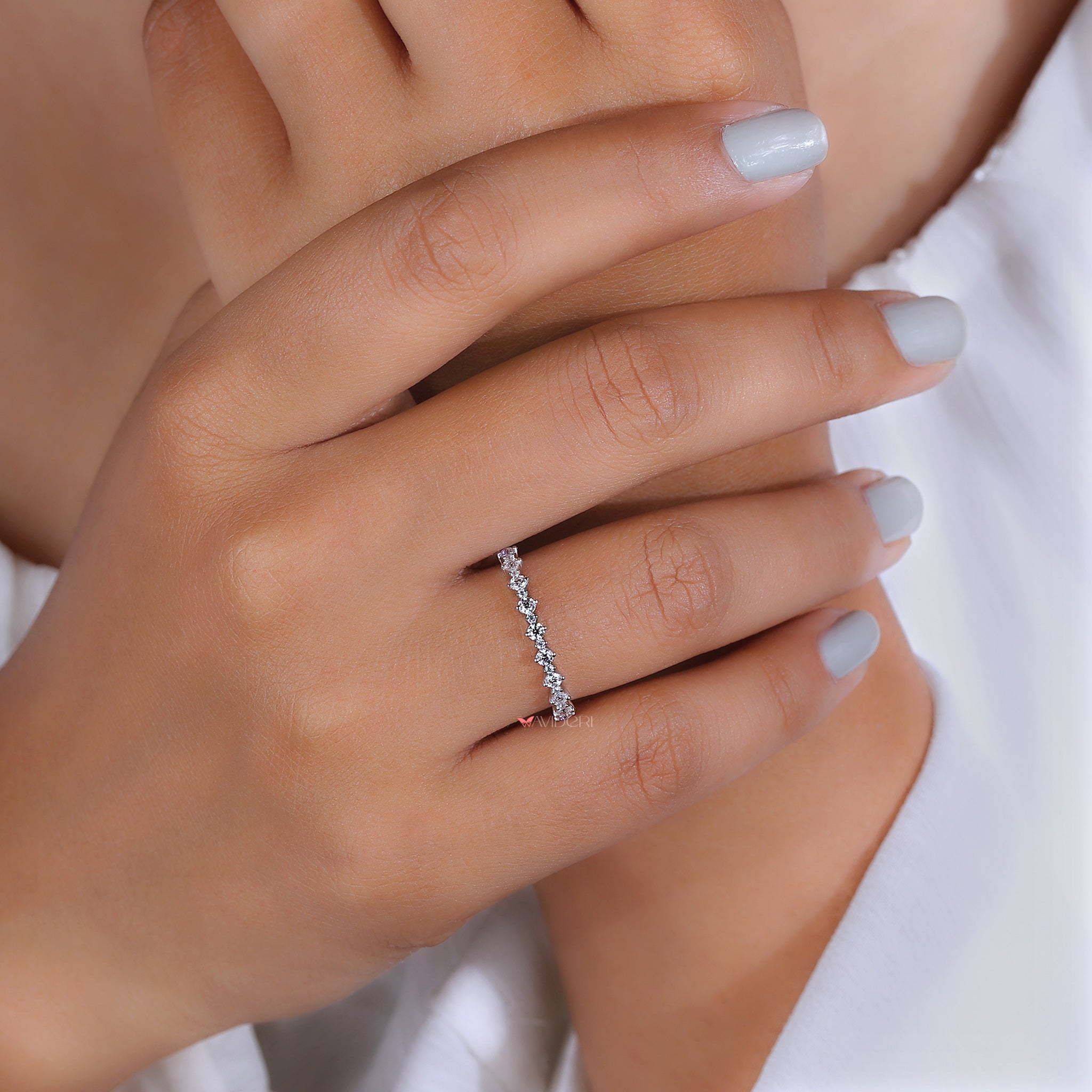 Handmade prong set moissanite eternity band.
