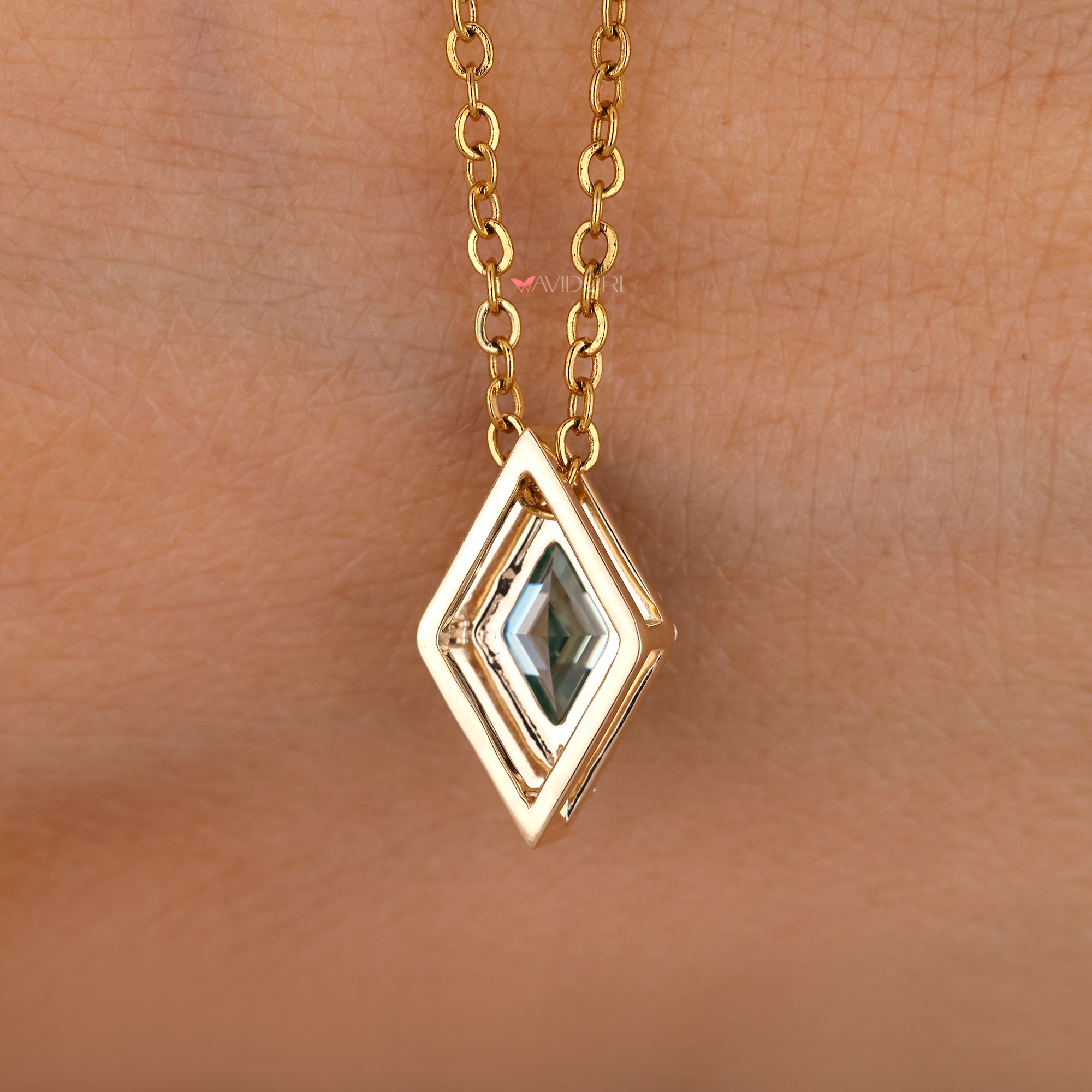 Handmade lozenge cut moissanite pendant.
