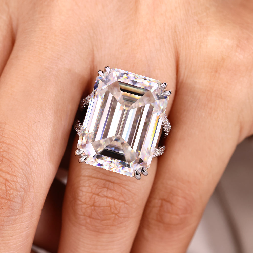 Handmade emerald cut ring with double claw prongs.