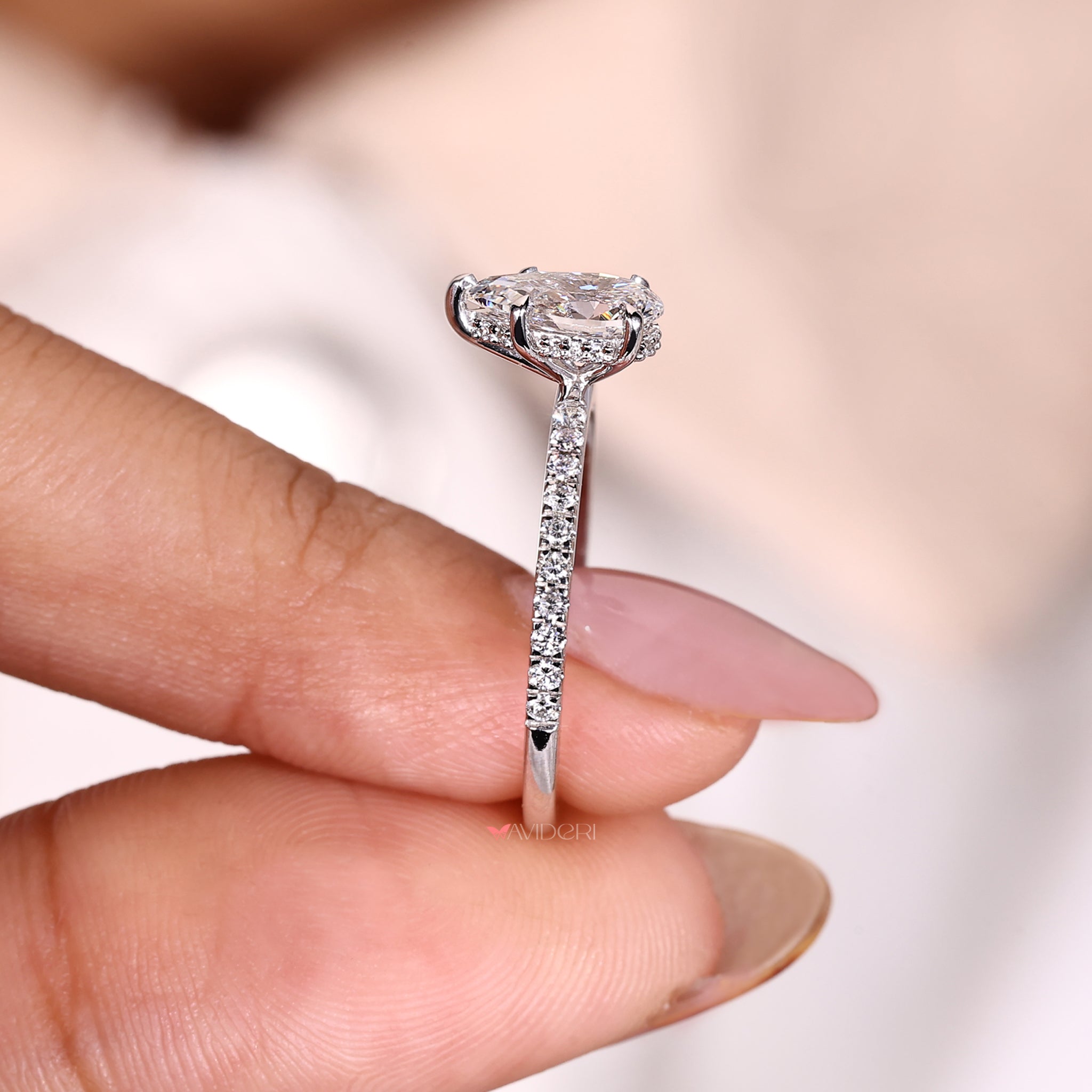 Hidden Halo Ring featuring a pear cut diamond for enhanced brilliance.