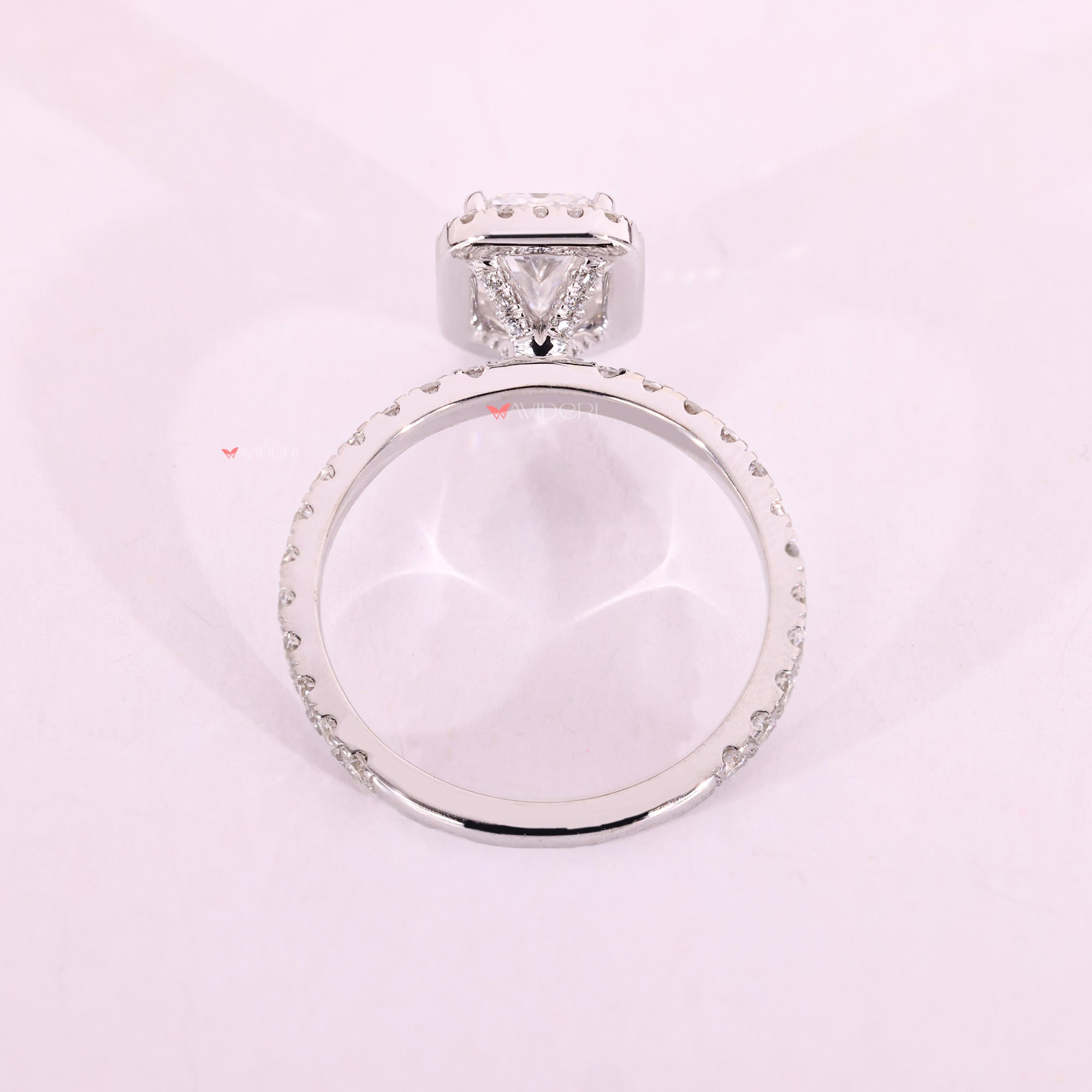 Pave diamond engagement ring with radiant center stone.