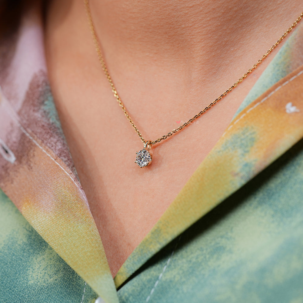 Yellow gold diamond pendant for a luxurious touch.
