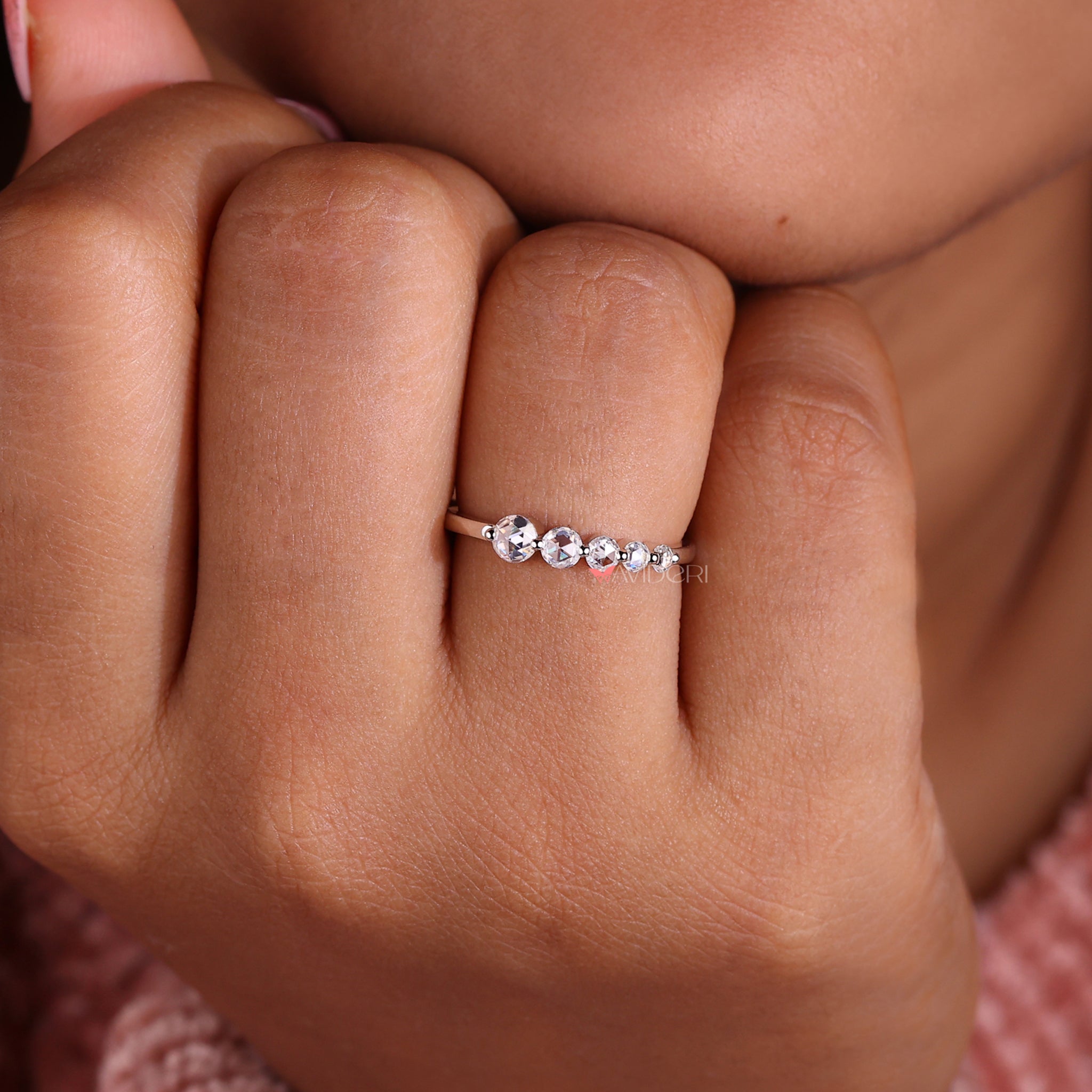 Shared prong wedding band designed for elegance.
