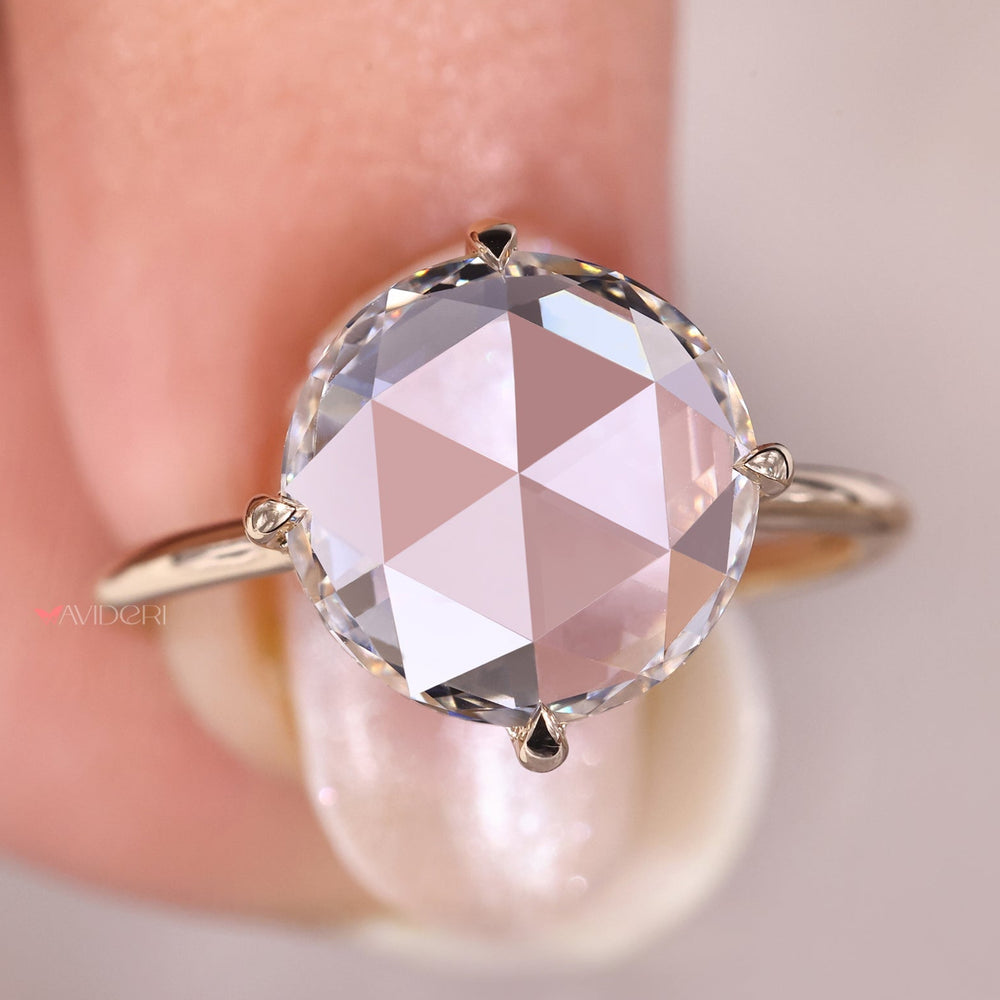 Yellow gold engagement ring with a round diamond center, designed for a bright and warm look.
