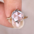 Yellow gold engagement ring with a round diamond center, designed for a bright and warm look.
