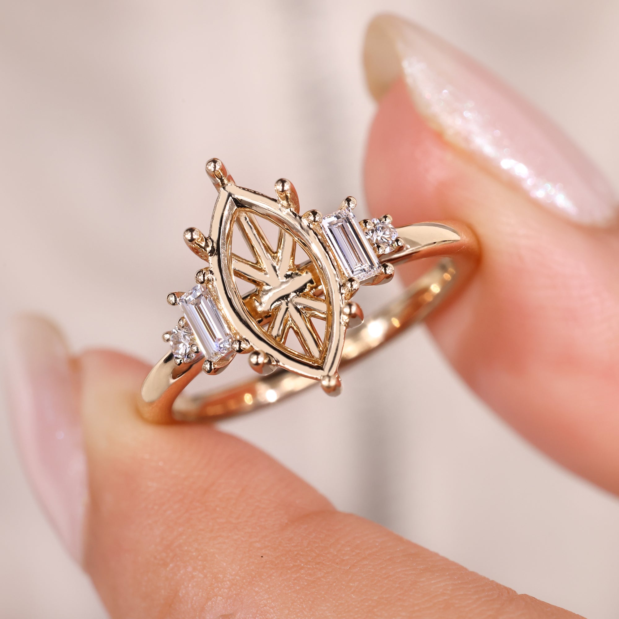 Marquise semi mount ring with five diamonds in yellow gold.
