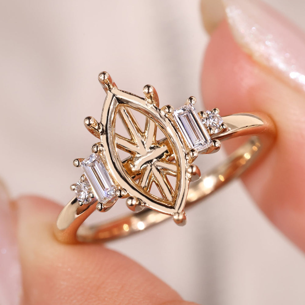 Marquise semi mount ring with five diamonds in yellow gold.
