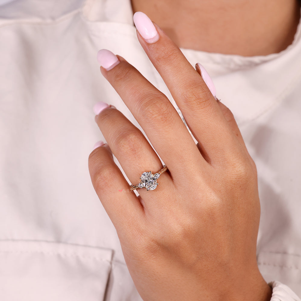 Oval diamond ring with art deco and side stones

