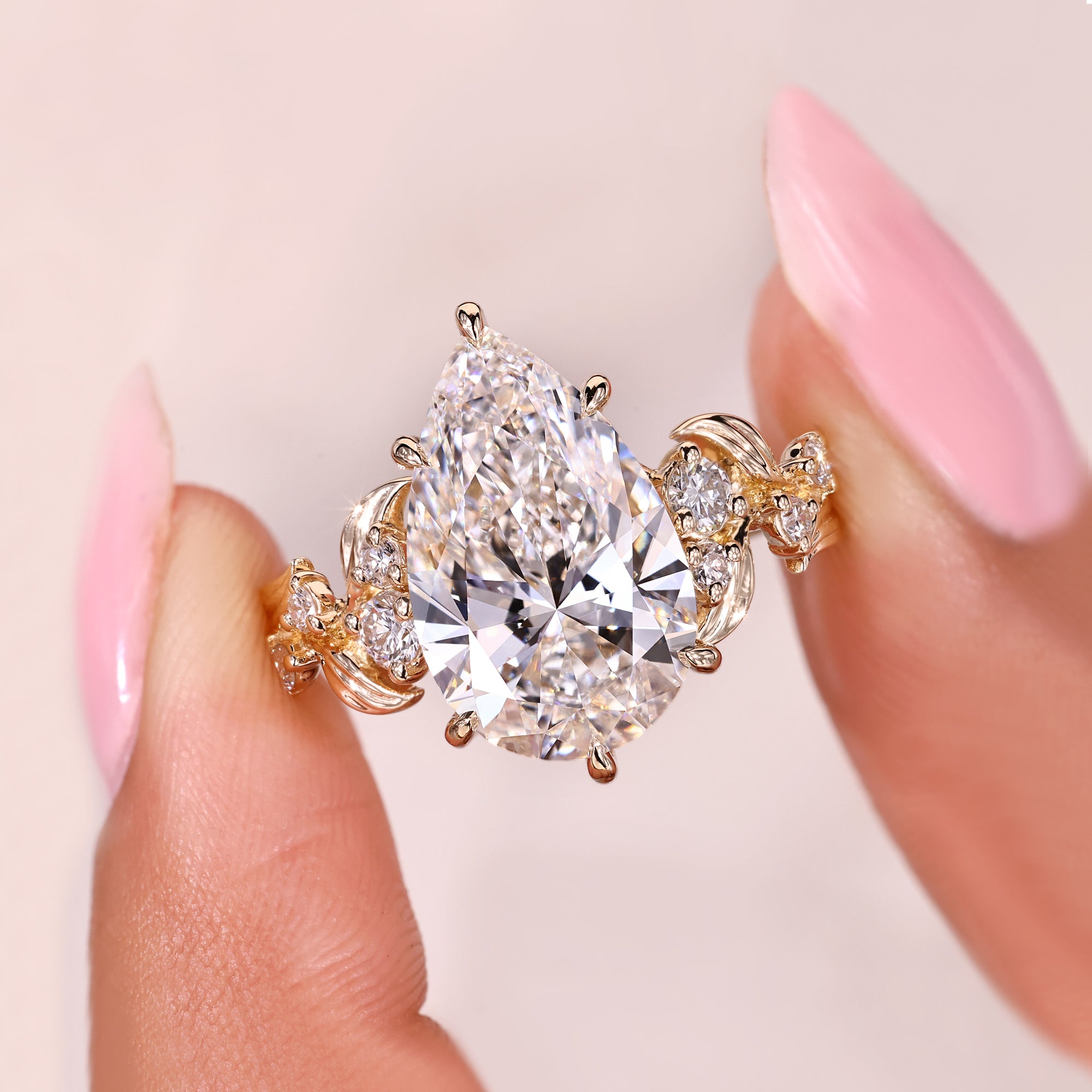 Pear cut lab grown diamond ring with secure six claw prongs.
