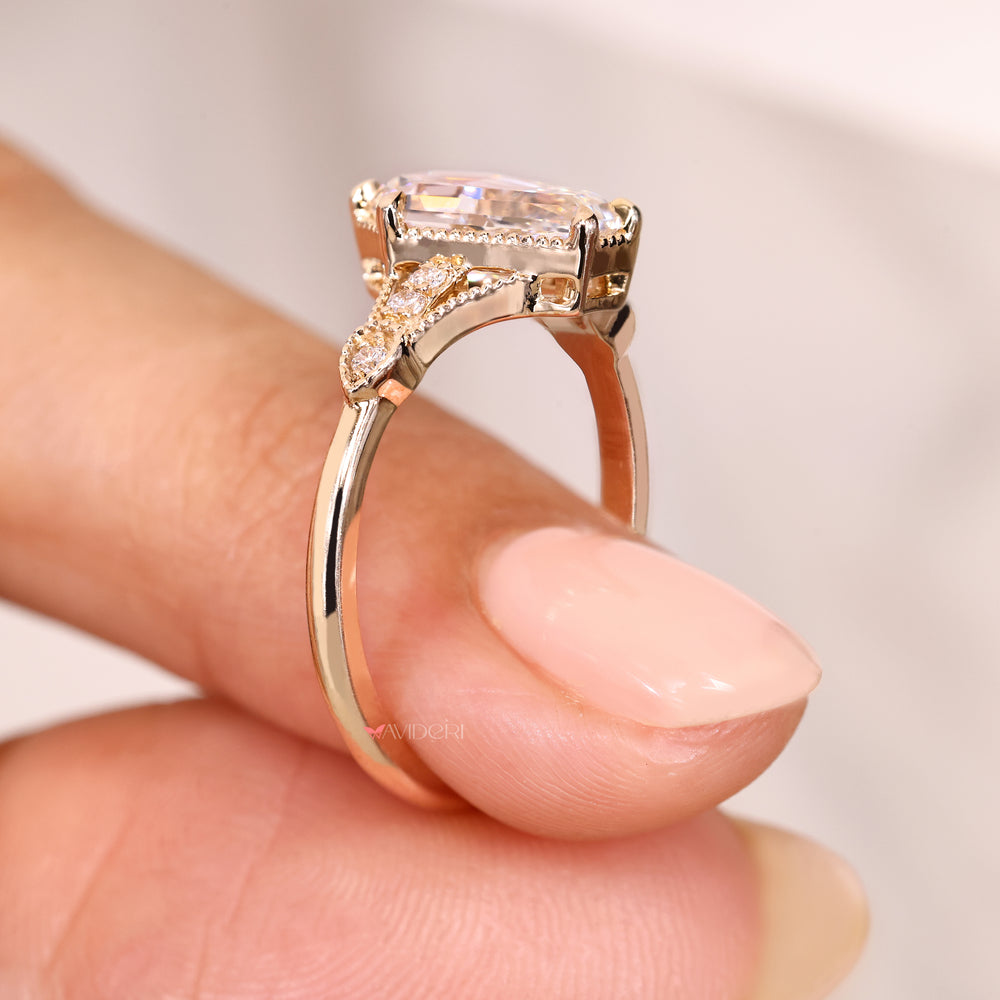 IGI certified shield cut diamond ring with side stones.
