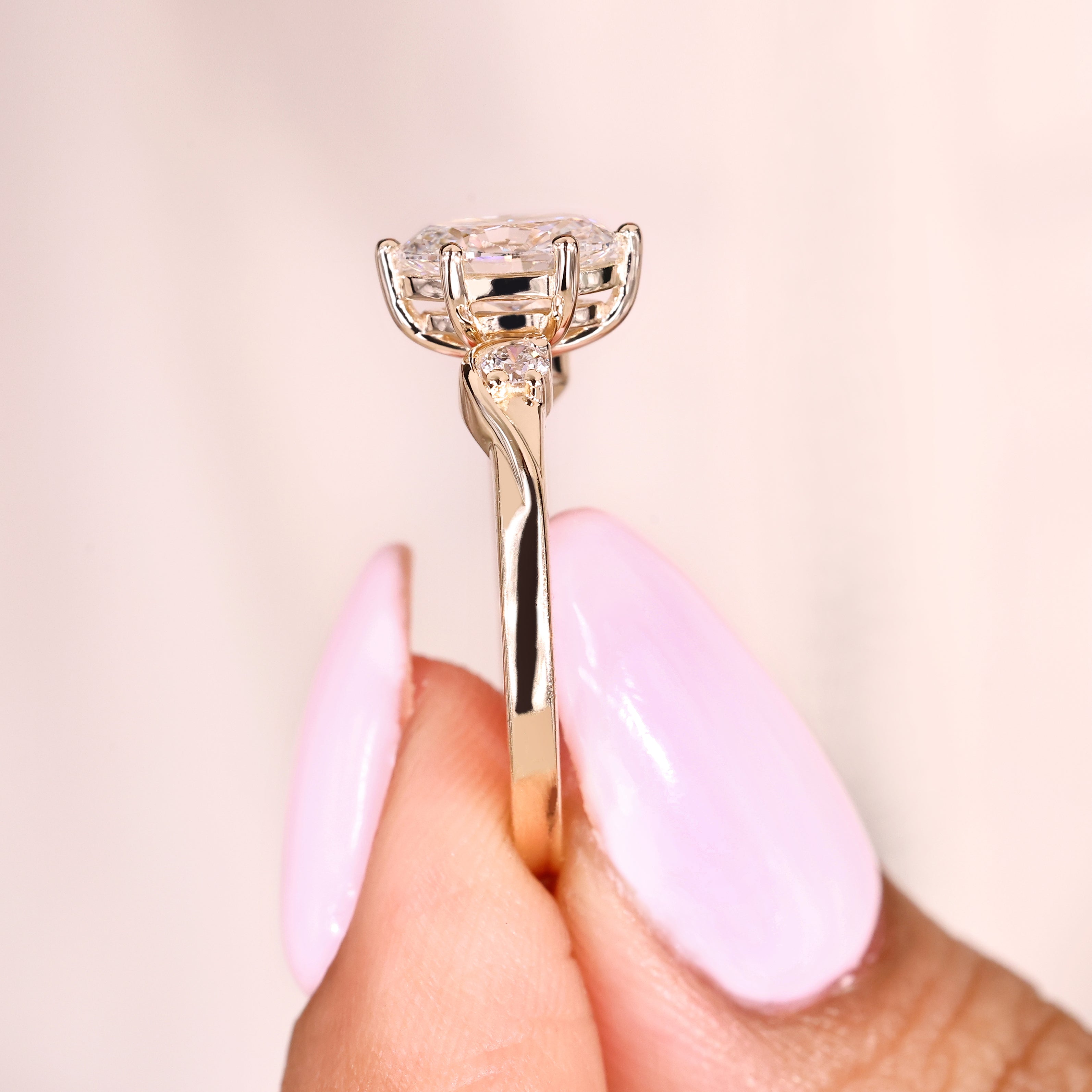 Three stone oval diamond ring with six prong setting
