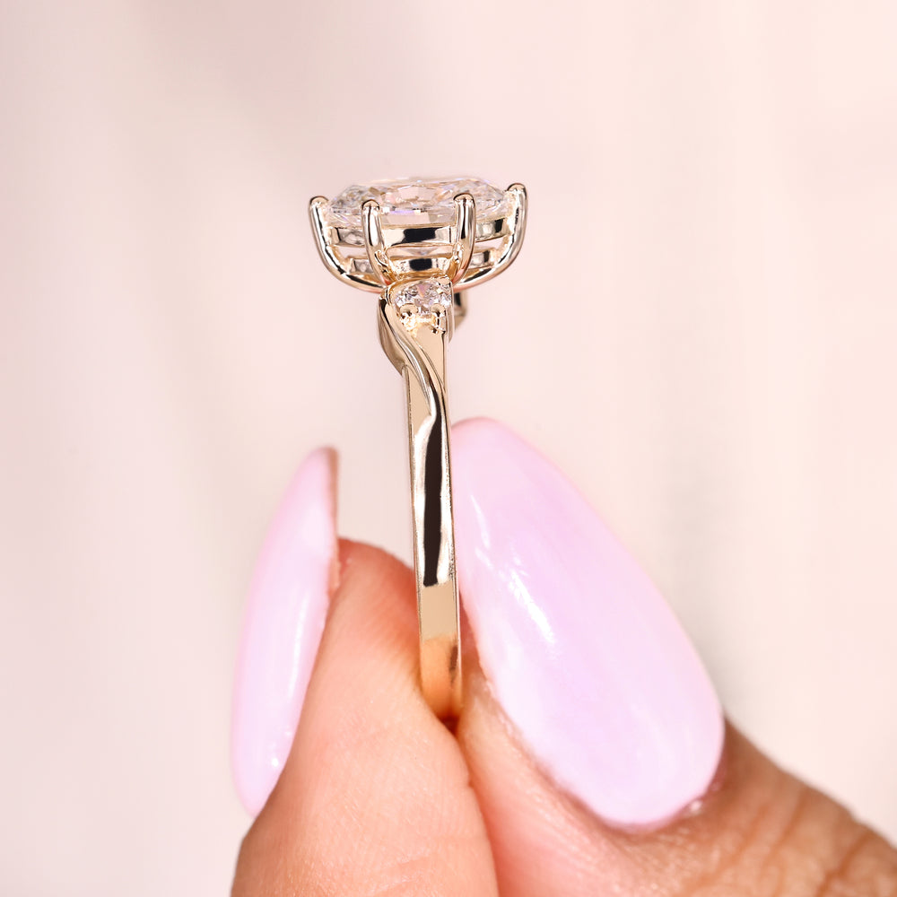 Three stone oval diamond ring with six prong setting
