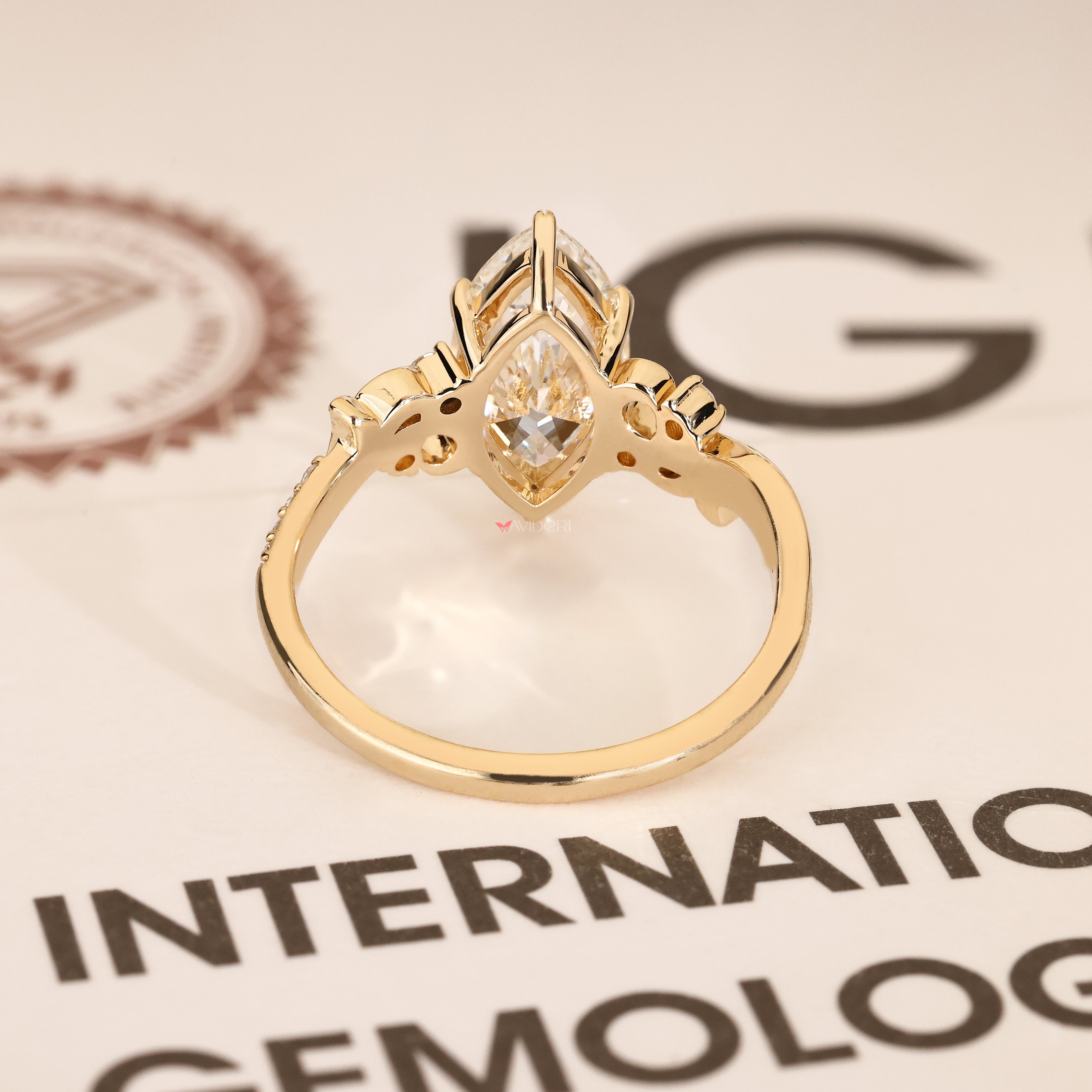Handmade fantasy ring with marquise diamond and round stones
