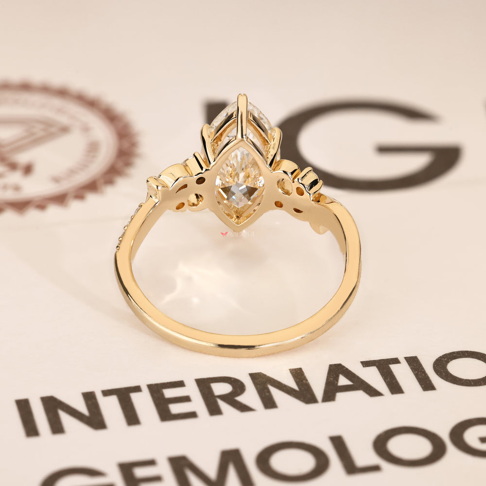 Handmade fantasy ring with marquise diamond and round stones
