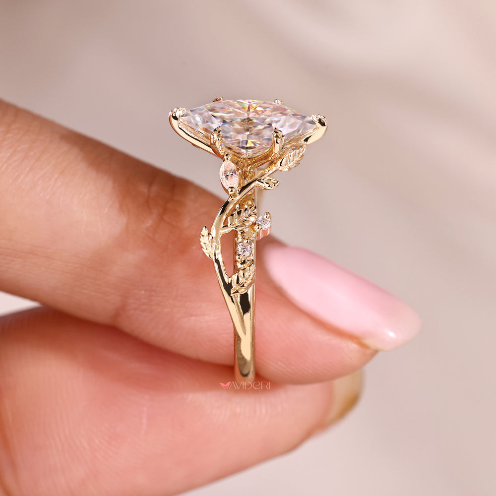 Round side stone ring with a marquise center.