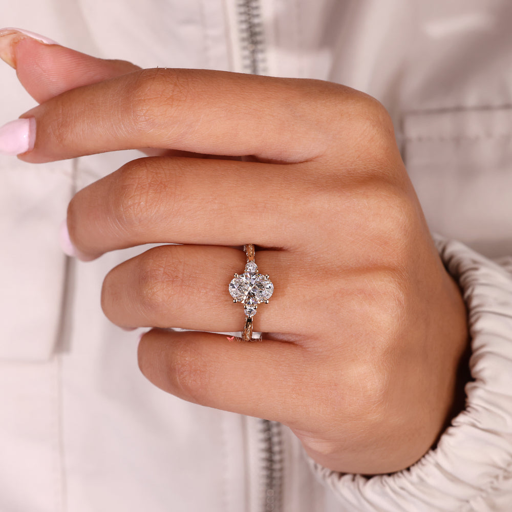 Handmade oval diamond ring with four prong setting
