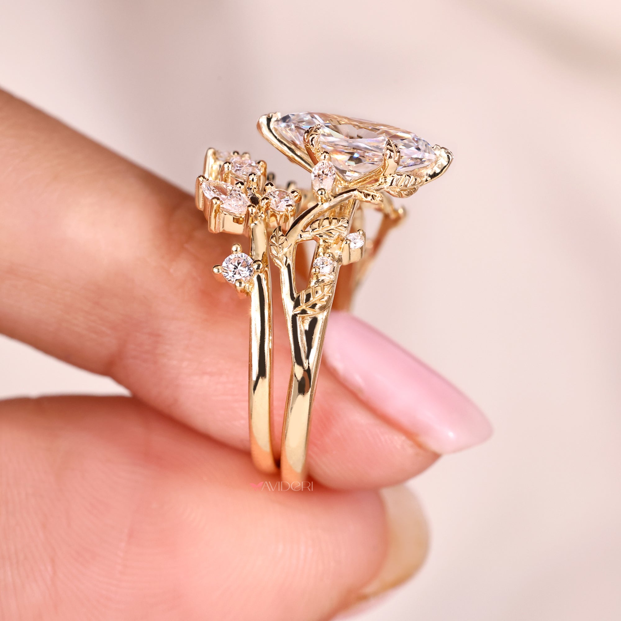 Marquise diamond ring with round side stones.