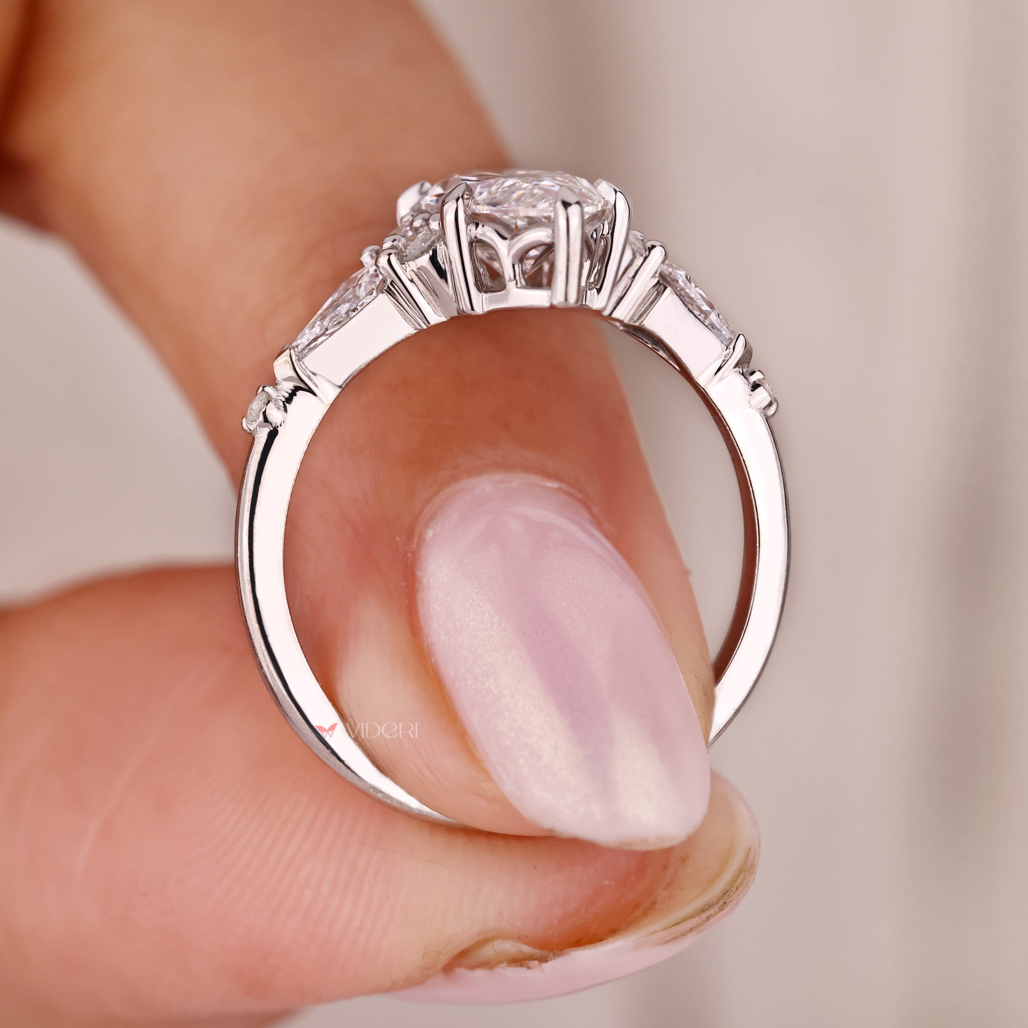 White gold engagement ring brings bright shine and sleek finish.