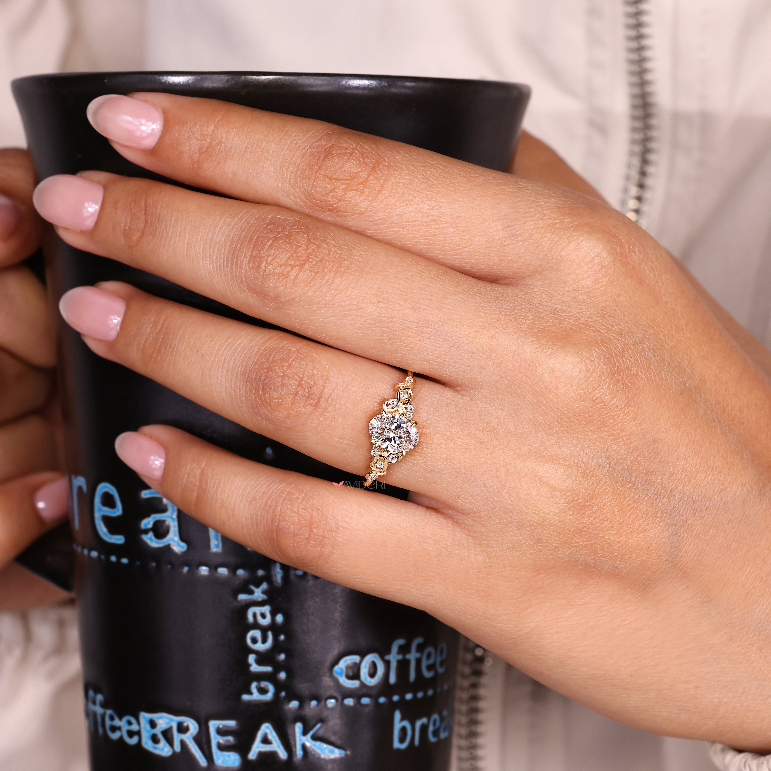 Nature inspired oval diamond ring claw prong.
