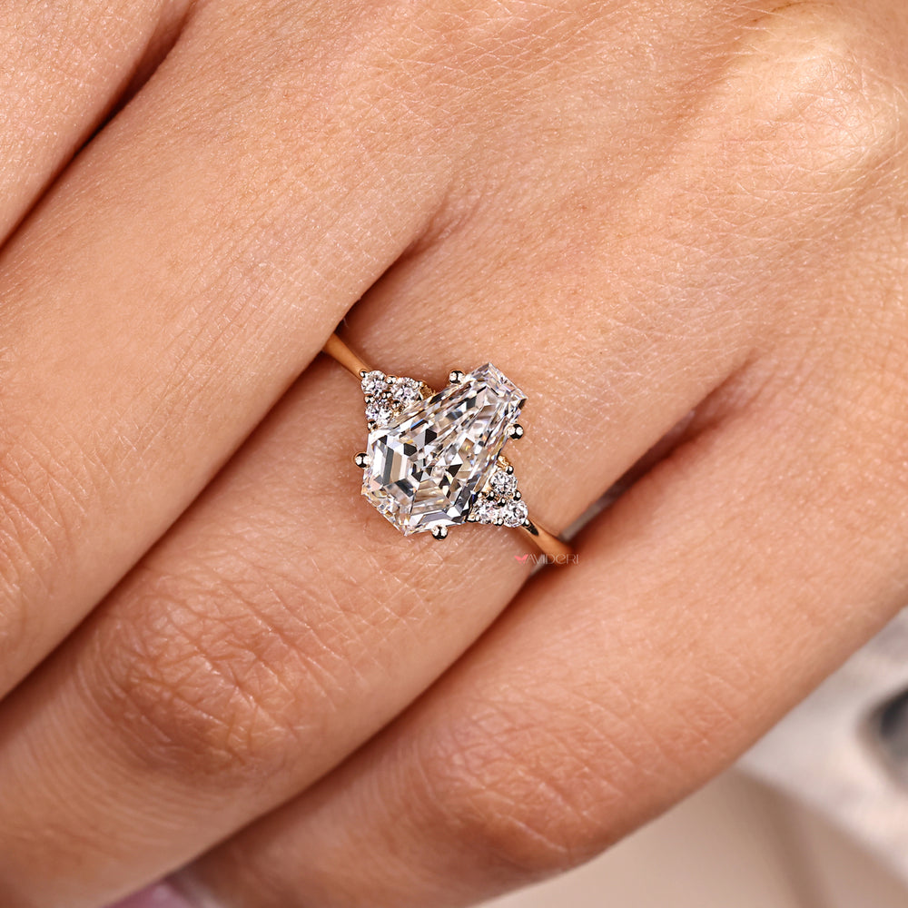 Handmade seven stone ring with coffin cut center stone.