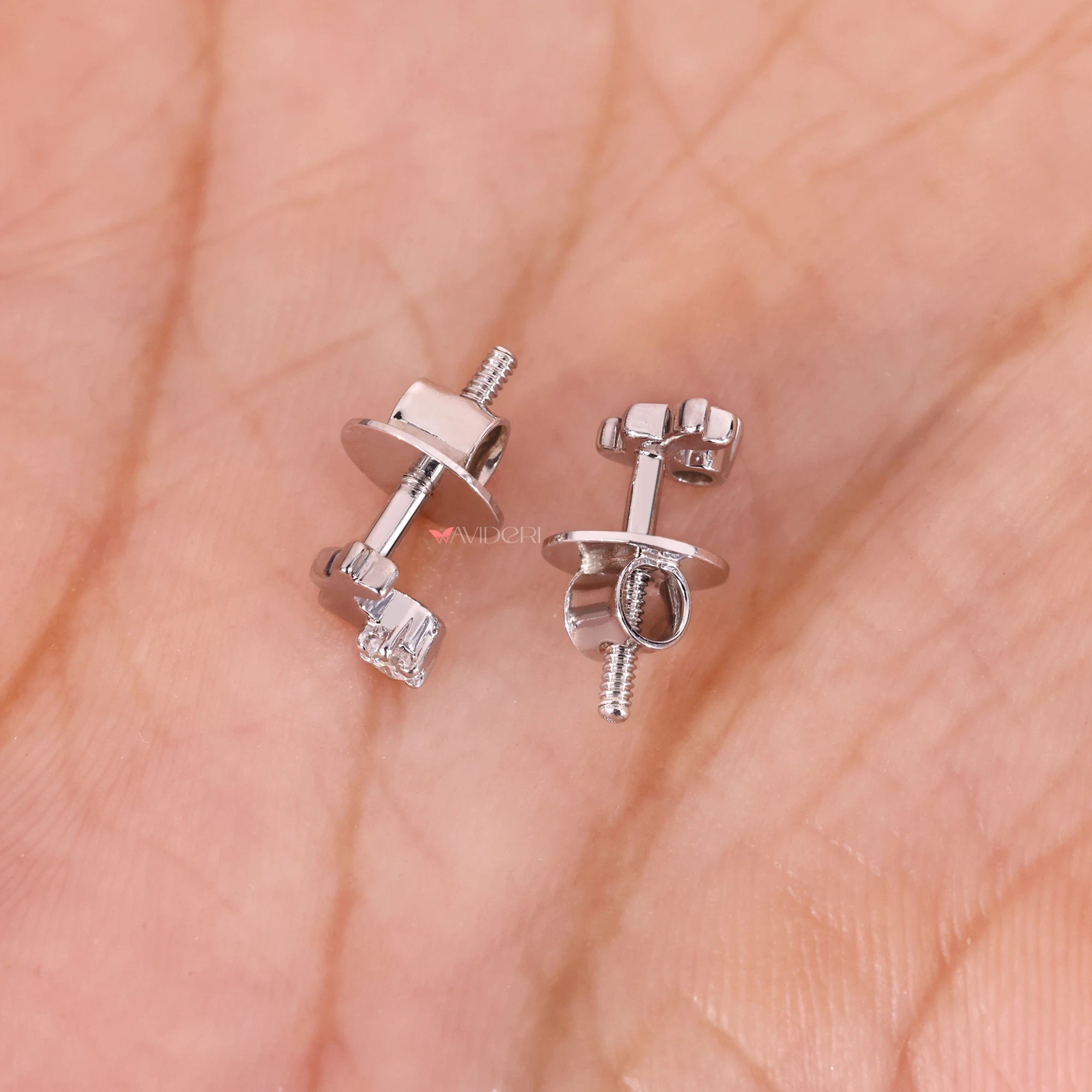 White gold diamond earrings with brilliant round stones.