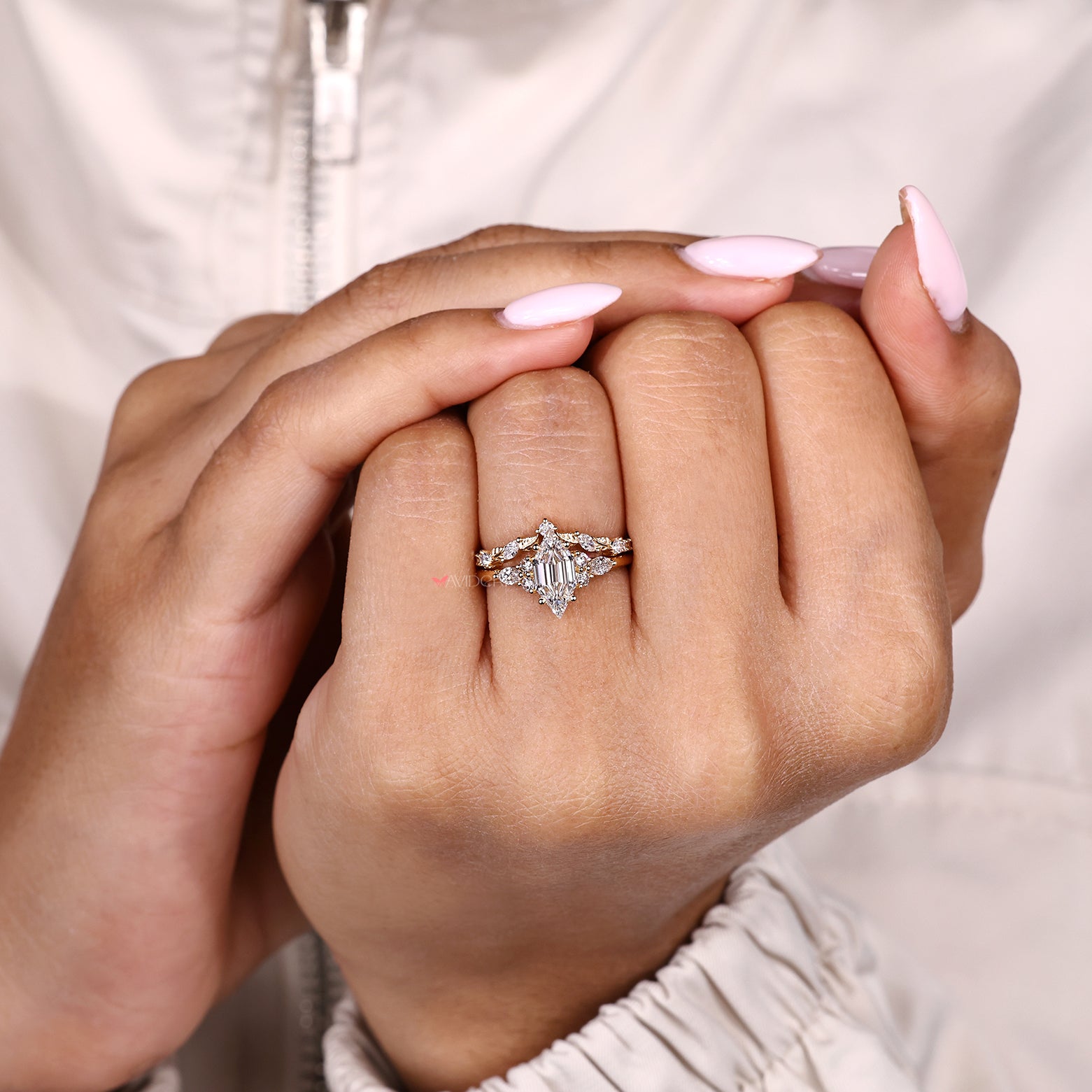 Art deco engagement ring with marquise and round diamond band
