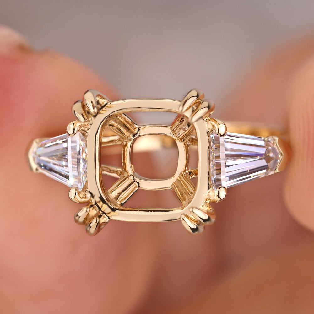 Semi mount 3 stone engagement ring in yellow gold.
