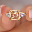 Semi mount 3 stone engagement ring in yellow gold.
