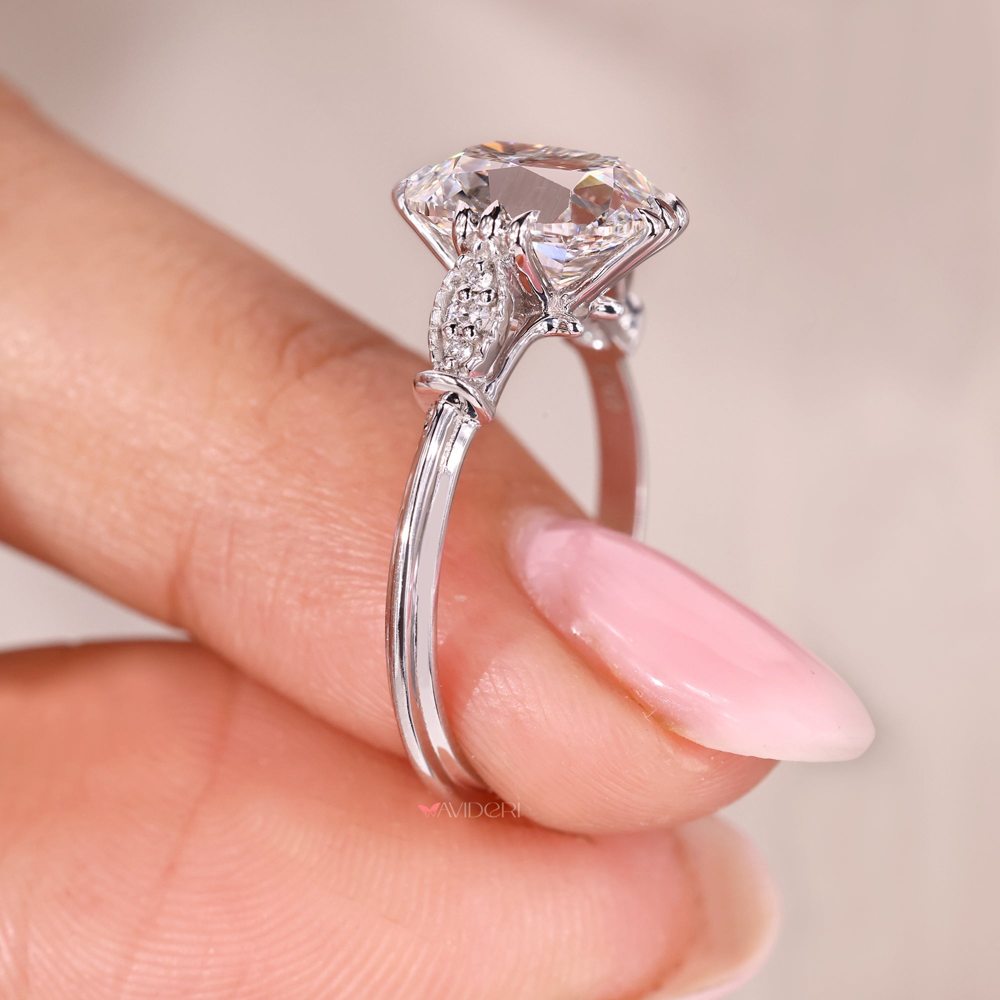 Milgrain side setting engagement ring with seven diamonds and unique design.