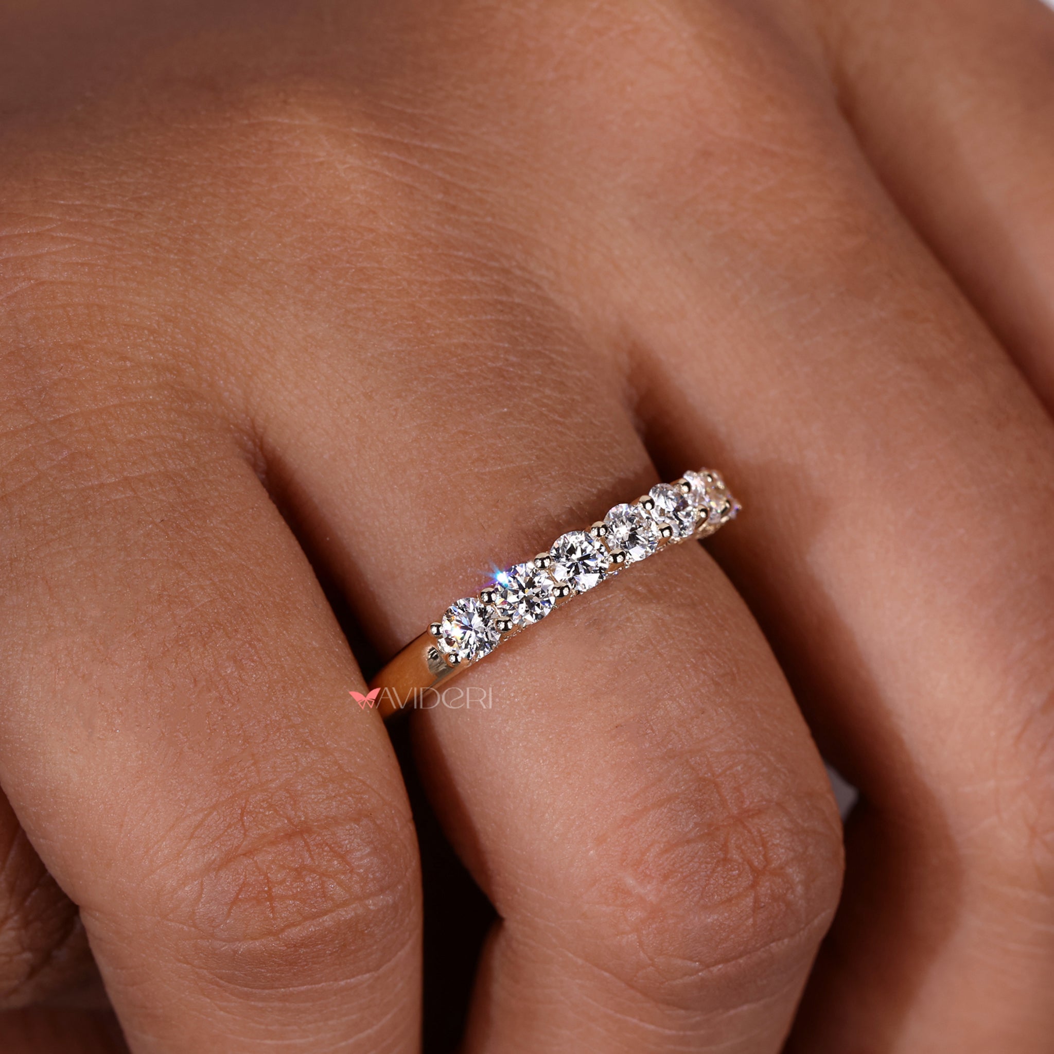 Half eternity wedding band in yellow gold with diamonds.
