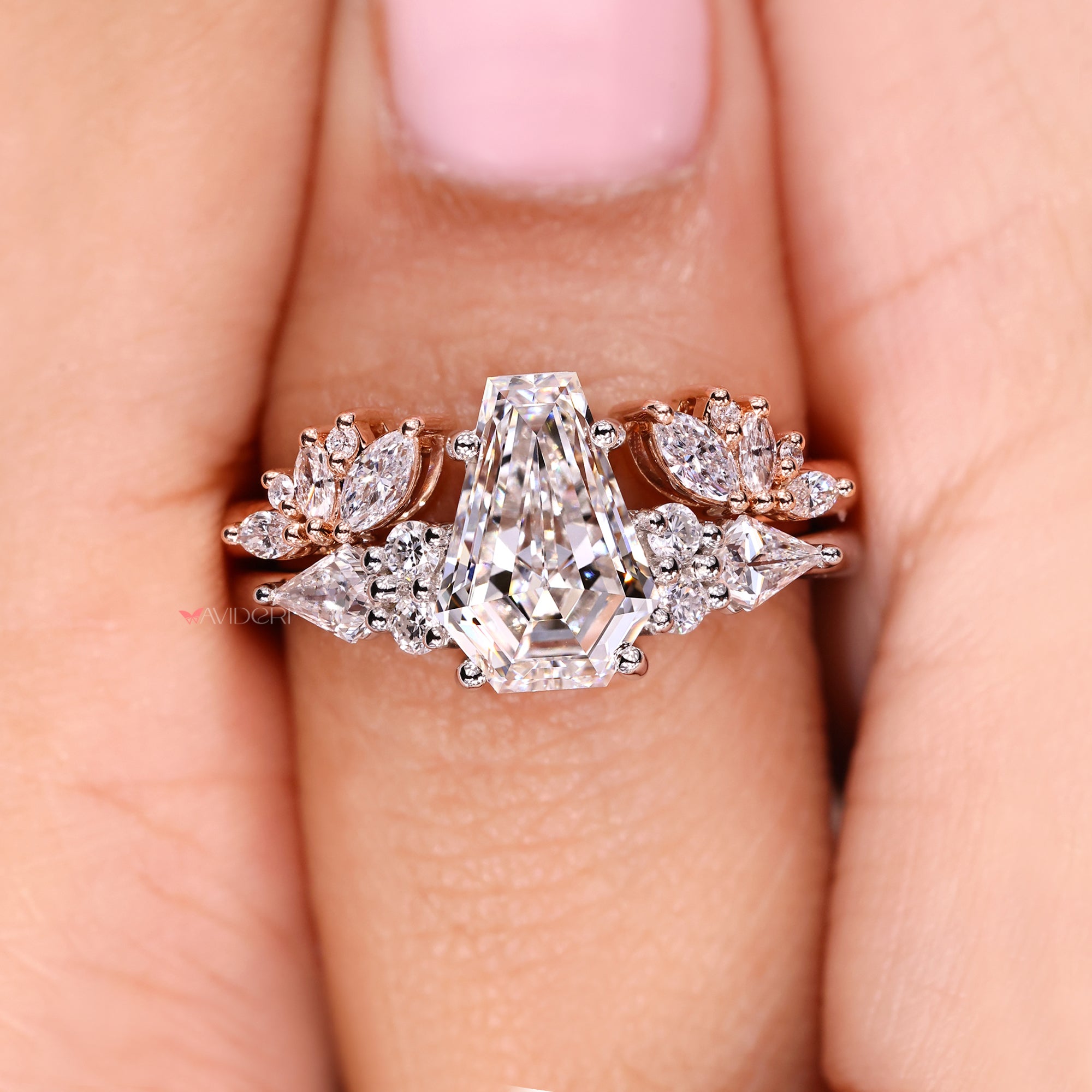 Tapered shank ring with a coffin cut center stone.