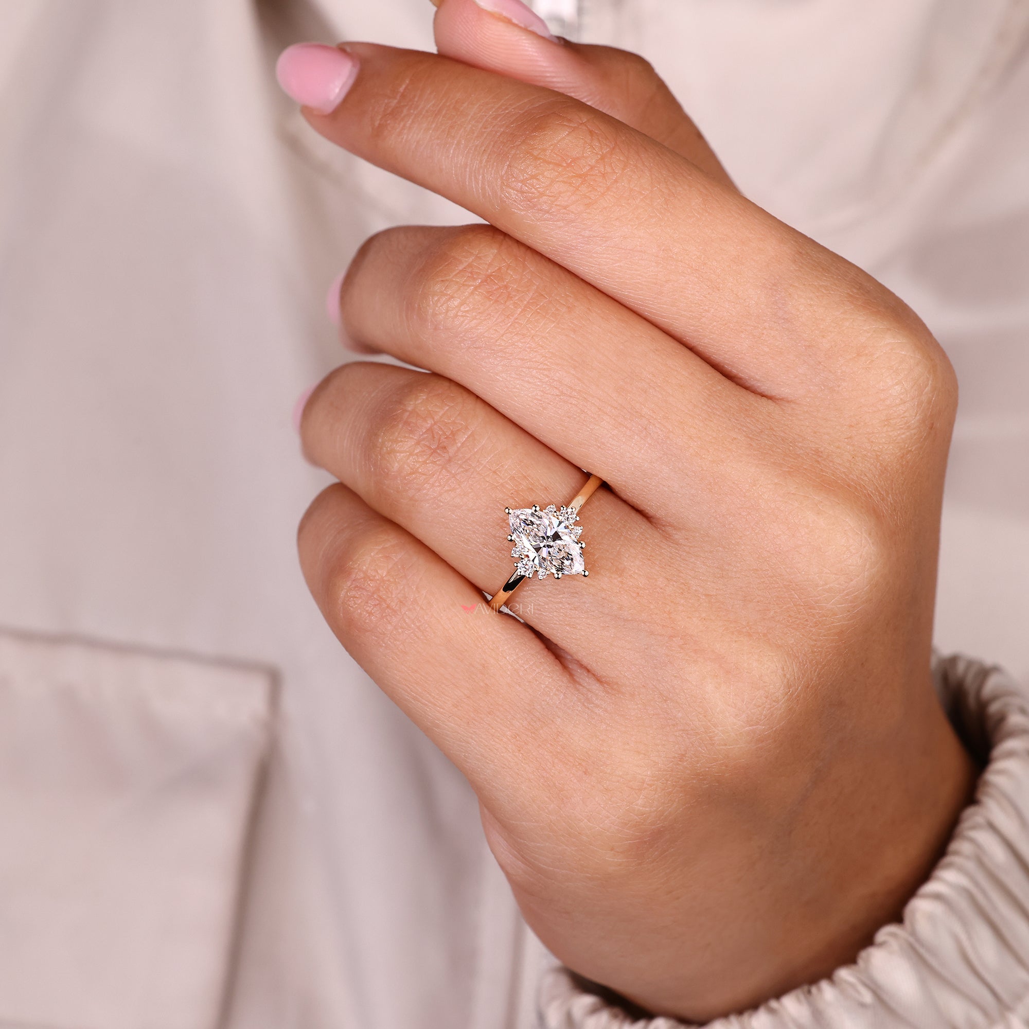 Seven stone marquise diamond ring with classic prong style.
